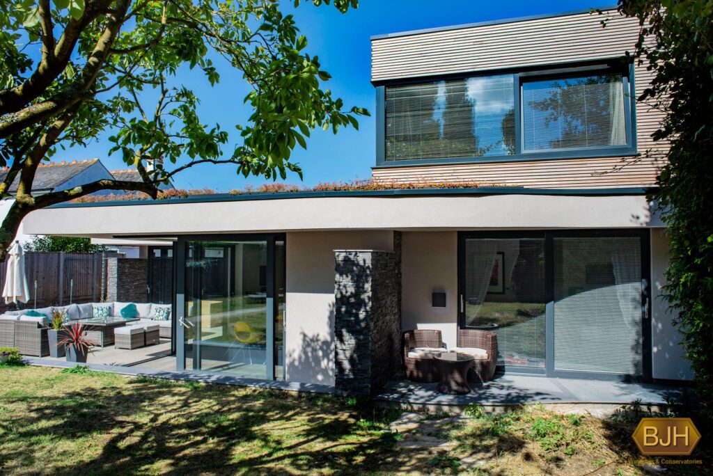 Modern minimalistic house with closed grey patio sliding doors