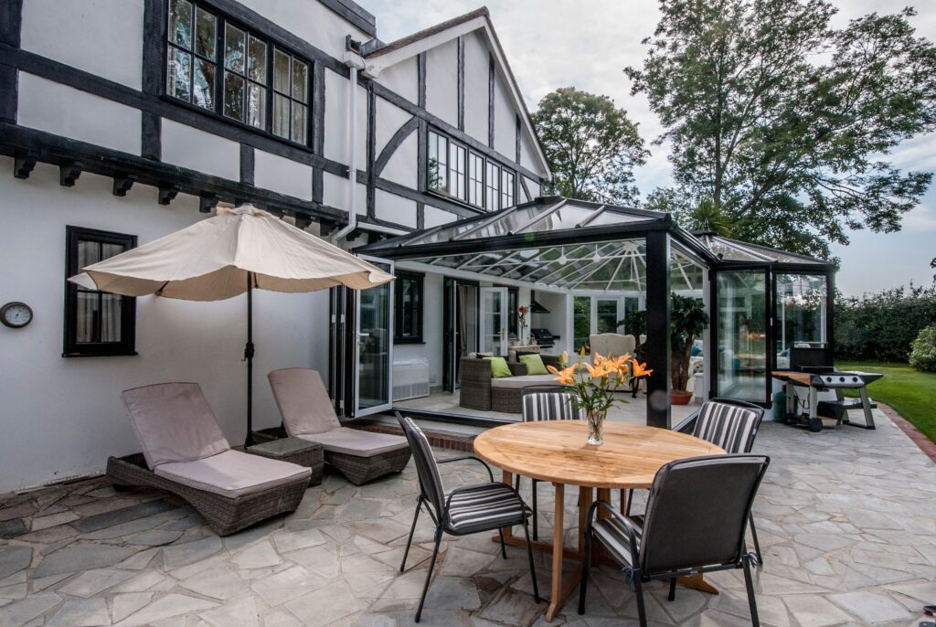 view of a conservatory part of a tudor themed like home