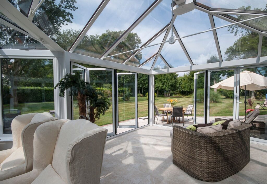 the inside of a conservatory looking out towards the garden