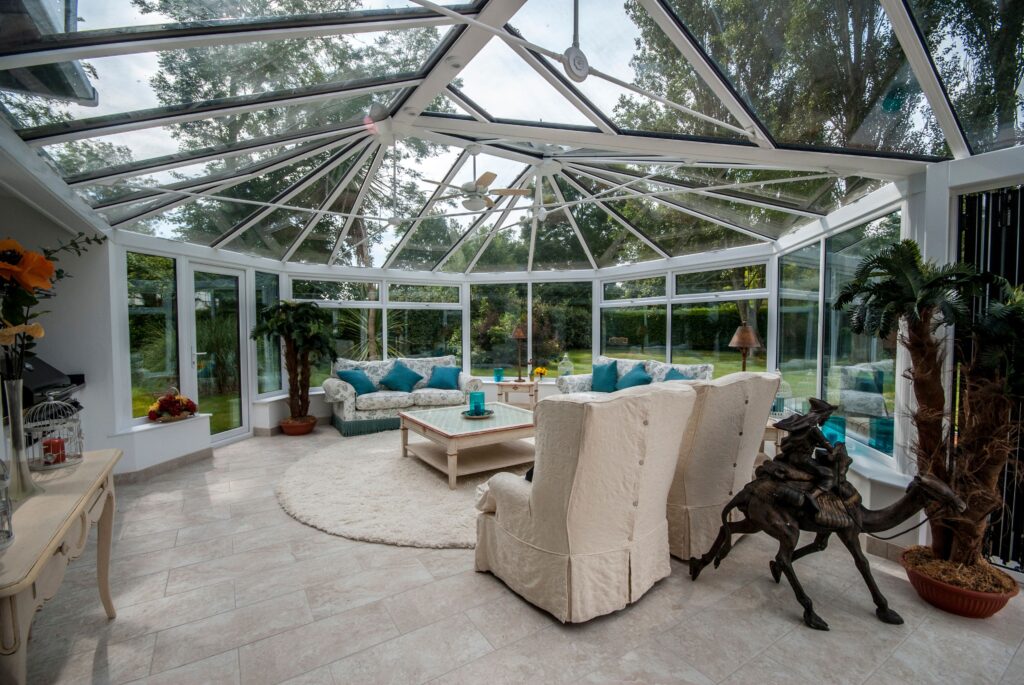 the inside of a circular and furnished conservatory