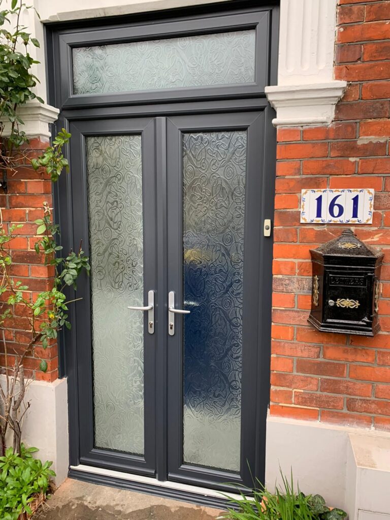 Anthracite grey uPVC French doors with decorative obscuring glazing