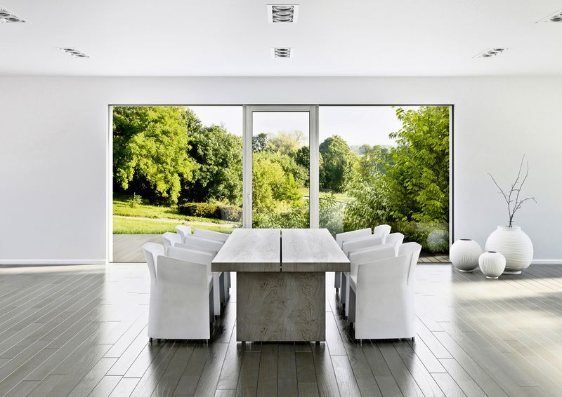 white half open Internorm sliding door behind a modern kitchen