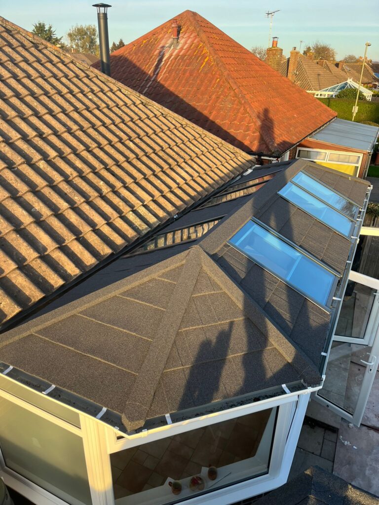 view looking down at a roof with some sky view windows on it